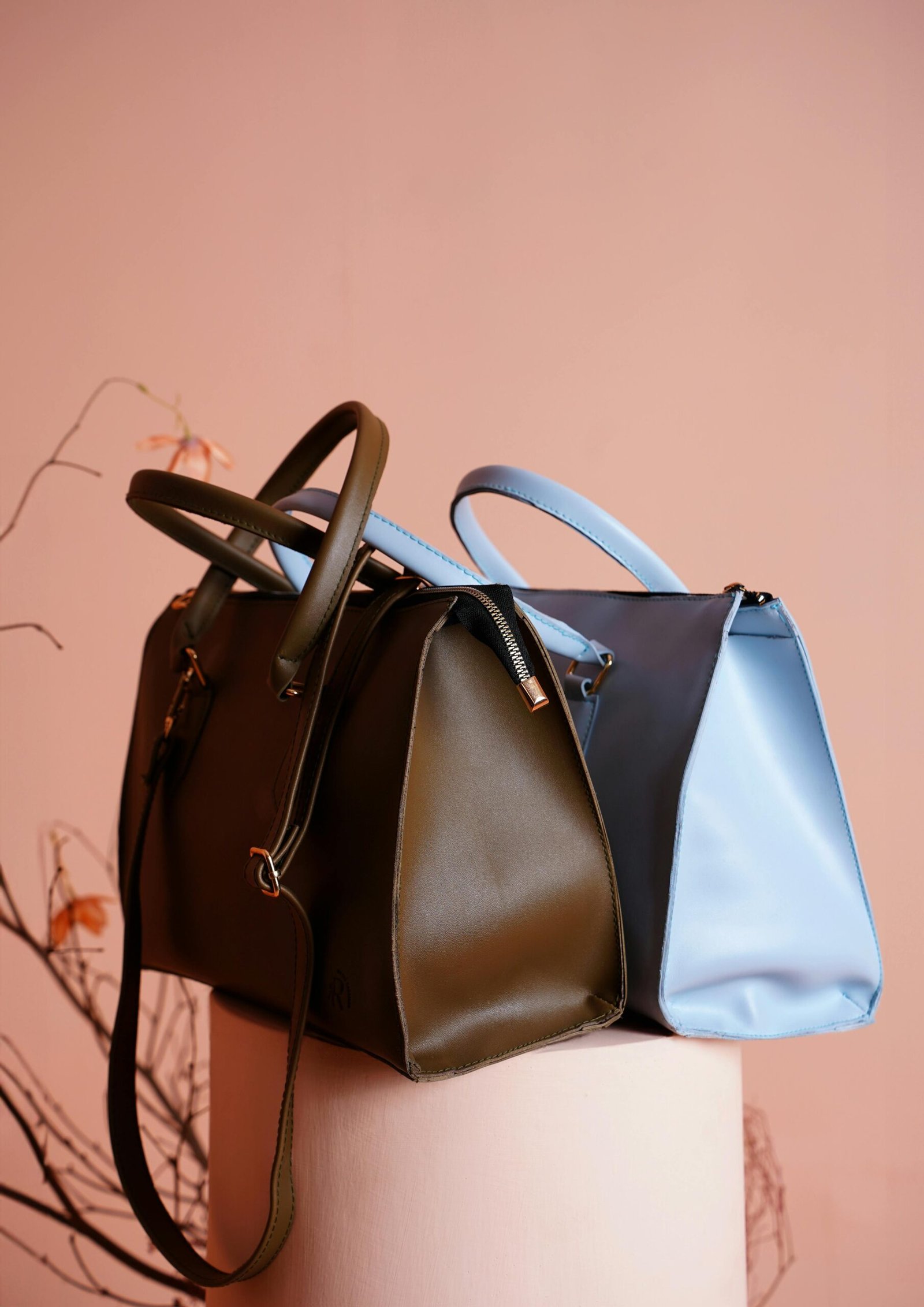 Home Chic designer handbags displayed in an elegant studio setup, highlighting modern fashion accessories.